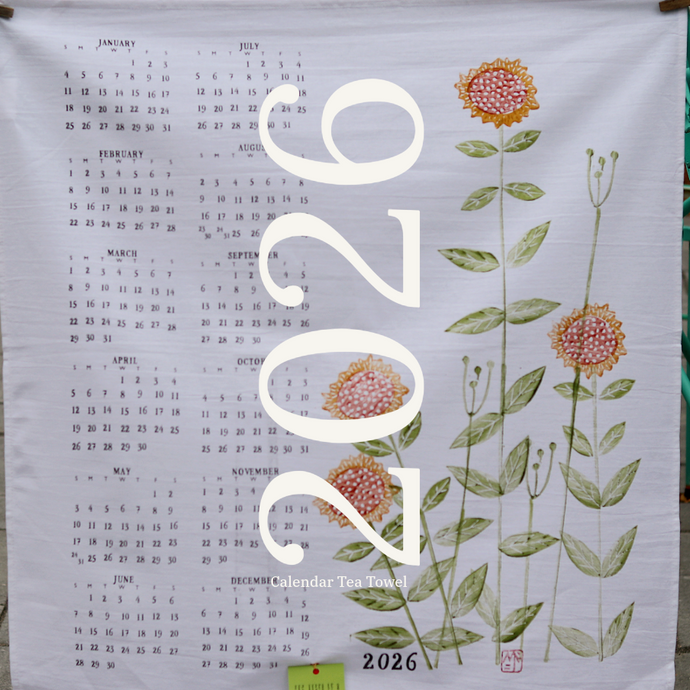 a tea towel with flowers and the 2026 calendar