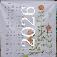 a tea towel with flowers and the 2026 calendar